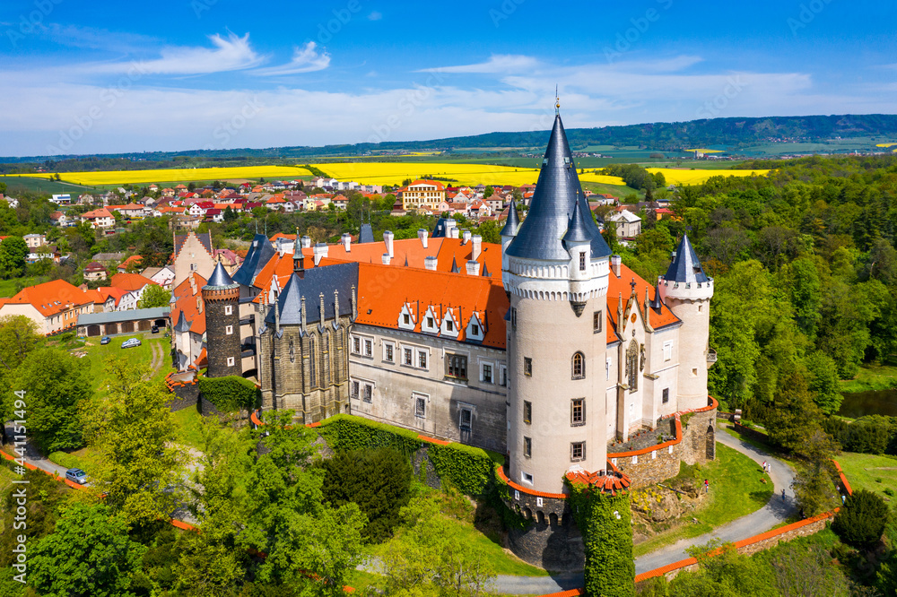 Aerial view of Zleby castle in Central Bohemian region, Czech Republic. The original Zleby castle was rebuilt in Neo-Gothic style of the chateau. Chateau Zleby, Czechia.