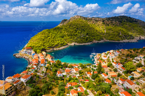 Fototapeta Naklejka Na Ścianę i Meble -  Aerial drone view video of beautiful and picturesque colorful traditional fishing village of Assos in island of Cefalonia, Ionian, Greece. Peninsula of Assos in Cephalonia (Kefalonia), Greece