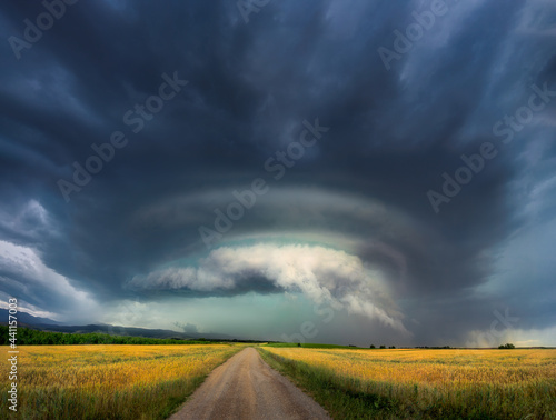 dramatic storm with stormy clouds and supercell on sky photo