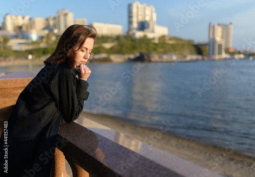 Woman in enjoys the sea shore.