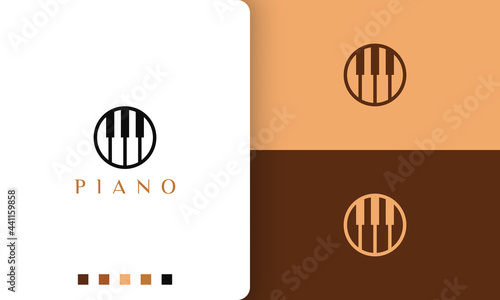 circle piano logo in simple and modern style suitable for pianist or music studio