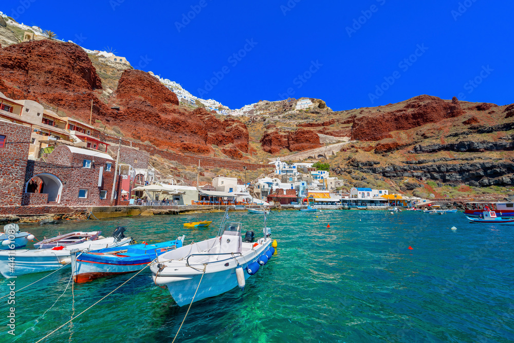 Greece Santorini island in Cyclades, Ammoudi village with fishing boats