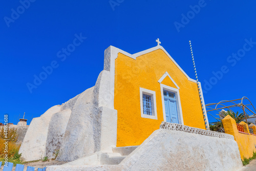 Greece Santorini island in Cyclades  traditional view of white washed houses with colorful wooden frames