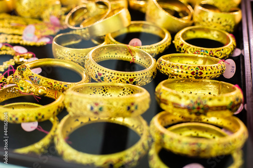 selective focus to gold and bracelet are gold jewelry in the showcase  the gold shop at Yaowarat  Bangkok  Thailand.