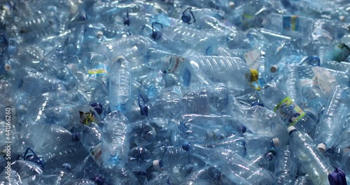 A lot of plastic blue bottles with caps. Close-up. Storage, reuse and recycling. Environmental protection concept.