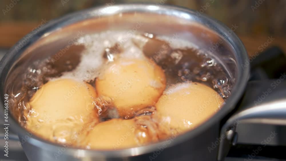 Cooking Food, A Healthy Breakfast in a Saucepan on the Stove. Food is Boiling in Water in a Saucepan, Close-up Cooking Food, A Healthy Breakfast in a Saucepan on the Stove. Food is Boiling in Water in a Saucepan, Close-up