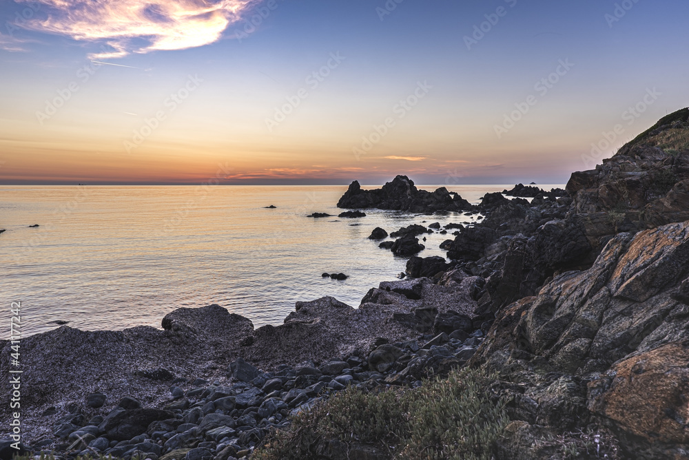 Rocky coastline at the famous Sanguinaires islands near corsican Ajaccio city under beautiful sunset light.