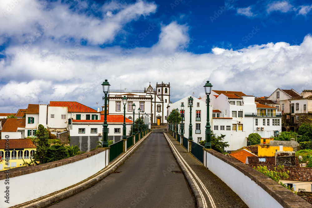 View of Nordeste on Sao Miguel Island, Azores. Old stone arch bridge in Nordeste village, Sao Miguel, Azores. Nordeste village with white town buildings on the island of Sao Miguel, Azores, Portugal.
