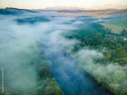 Fog and Mist at Sunrise Over Dunajec River in Pieniny, Poland. Aerial Drone View