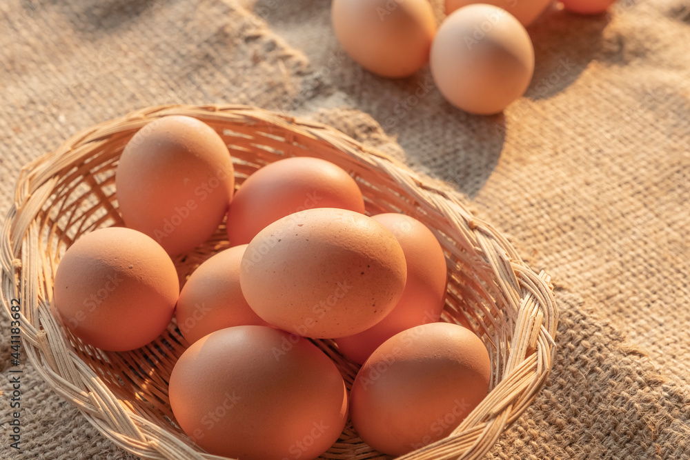 fresh eggs in a wooden basket from agriculture farm. fresh eggs in a wooden basket from agriculture farm.