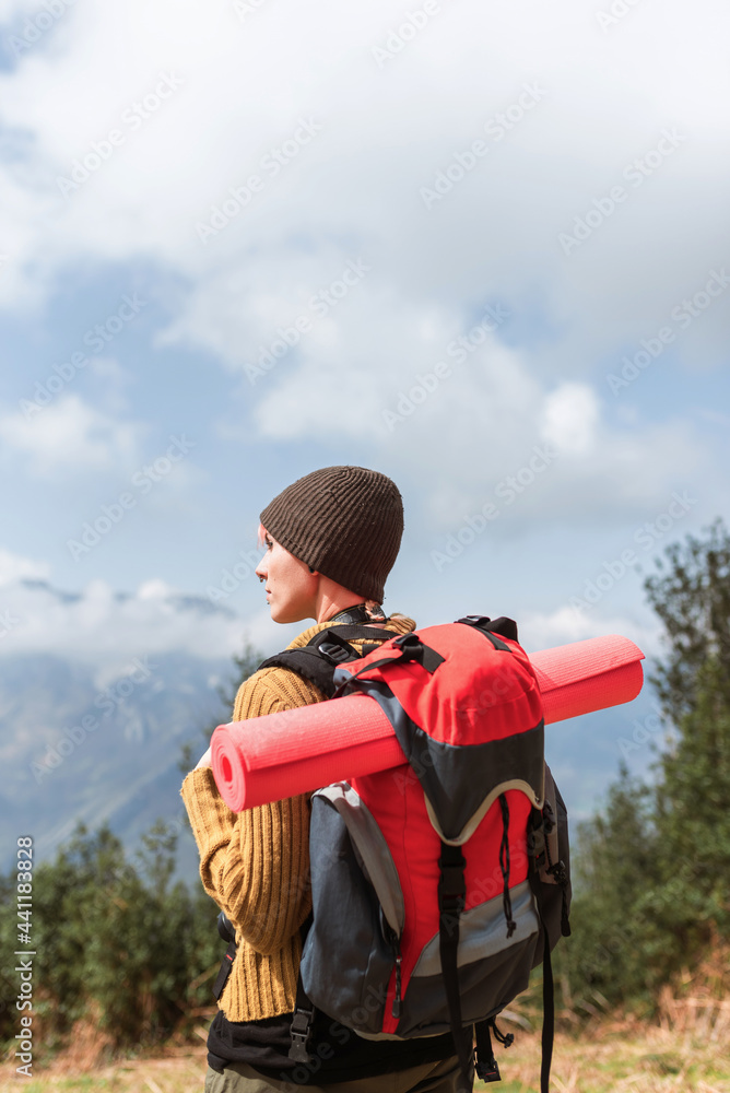 Female traveler enjoying landscape in mountains Female traveler enjoying landscape in mountains