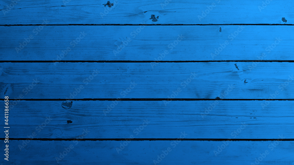Fototapeta premium Top view of blue background wooden planks board texture.