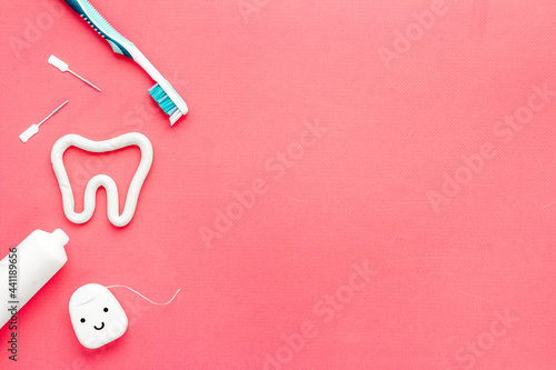 Toothbrush with tube of toothpaste and dental floss. Oral care and dental hygiene