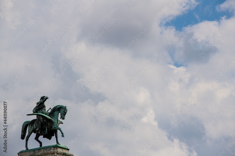 winged horse statue on the rooftop of the Vienna opera house with cloud sky and copy space winged horse statue on the rooftop of the Vienna opera house with cloud sky and copy space