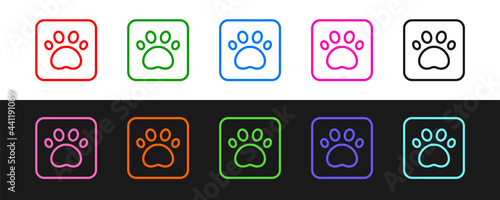 Set line Paw print icon isolated on black and white background. Dog or cat paw print. Animal track. Vector