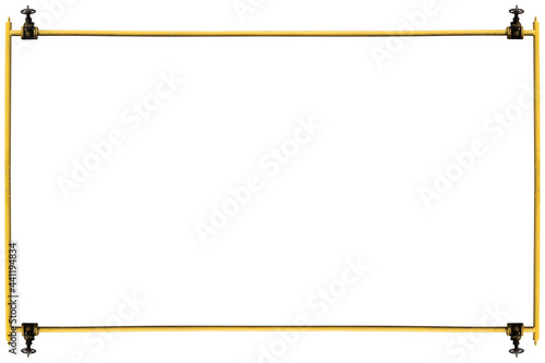 The frame is made of shabby yellow gas pipes with valves, isolated on white.