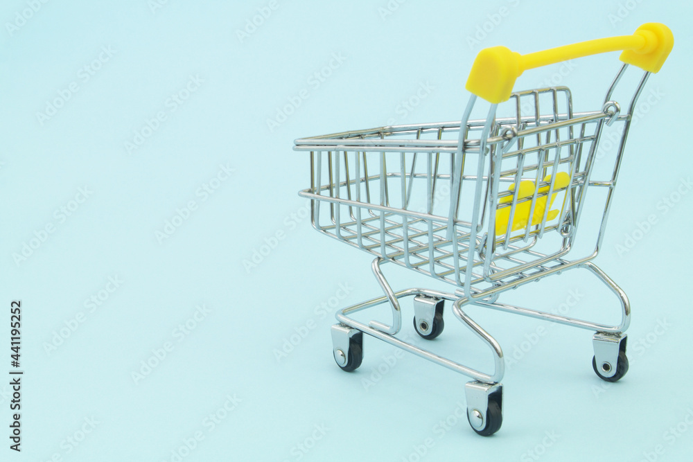 Shopping cart on blue background with space for text, buy and sale concept. Shopping cart on blue background with space for text, buy and sale concept.