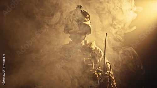 Portrait of Special Forces Operator in full protection gear with assault rifle