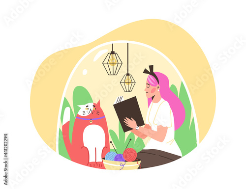 Happy girl introvert sitting under transparent dome with cat and reading book.