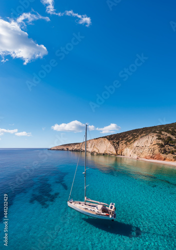 Sailboat at anchor in the clear sea of Lakoudi on the southeast coast of the remote Greek island of Gavdos south of Crete in the Libyan Sea