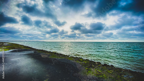view of the north sea in zeeland netherlands at brouwersdam photo