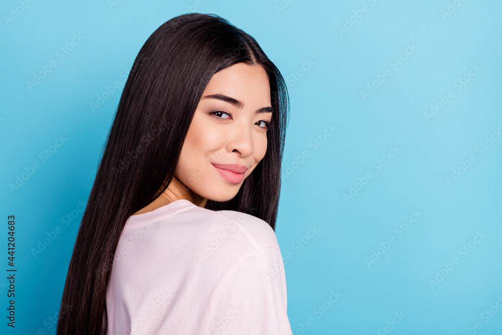 Profile side photo of young attractive pretty chinese asian girl happy positive smile isolated over blue color background Profile side photo of young attractive pretty chinese asian girl happy positive smile isolated over blue color background
