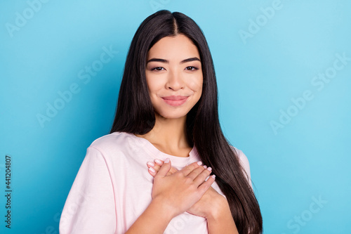 Fotografie Photo of young girl happy positive smile hands on chest appreciate grateful isol