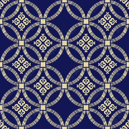 Abstract geometric seamless pattern with circles, Gold and blue-black background.