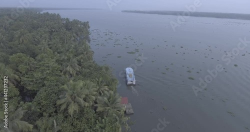 kerala location alappuzha boat moving in water log fotage  photo