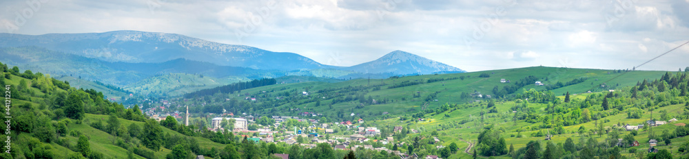 Panorama of the small town of Yasinia against the backdrop of the mountains