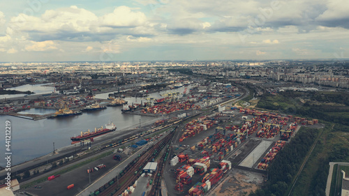 Aerial view of high-tech modern seaport with cranes and loaders