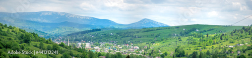 Panorama of the small town of Yasinia against the backdrop of the mountains