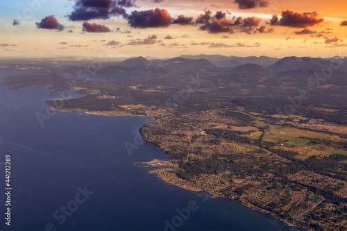 Aerial View of Qualicum Beach from an Airplane on the shore of Strait of Georgia in Vancouver Island, British Columbia, Canada. Colorful Sunset Sky Art Render.