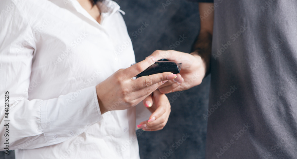 a man gives a woman a wallet