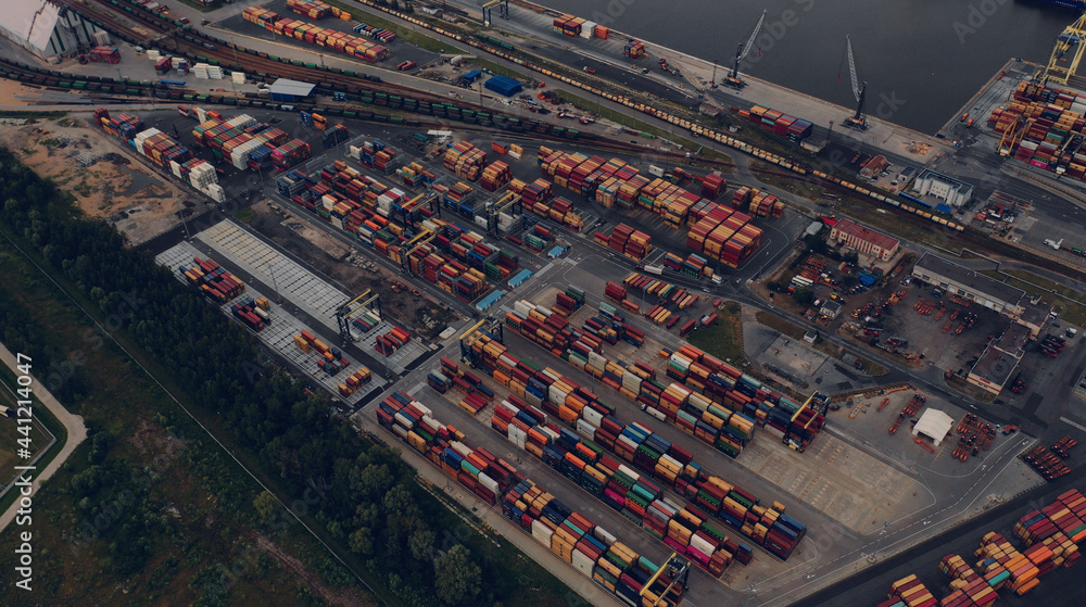 Aerial view of high-tech modern seaport with cranes and loaders Aerial view of high-tech modern seaport with cranes and loaders