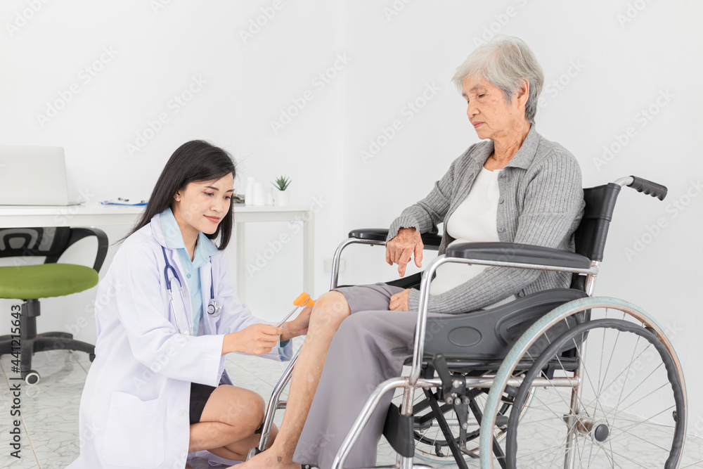 smart asian female doctor use hammer jerk hit to knee of patient, she assess knee symptom of patient ,elderly rehabilitation clinic, they training to rehab muscle, replacement of knee osteoarthritis smart asian female doctor use hammer jerk hit to knee of patient, she assess knee symptom of patient ,elderly rehabilitation clinic, they training to rehab muscle, replacement of knee osteoarthritis