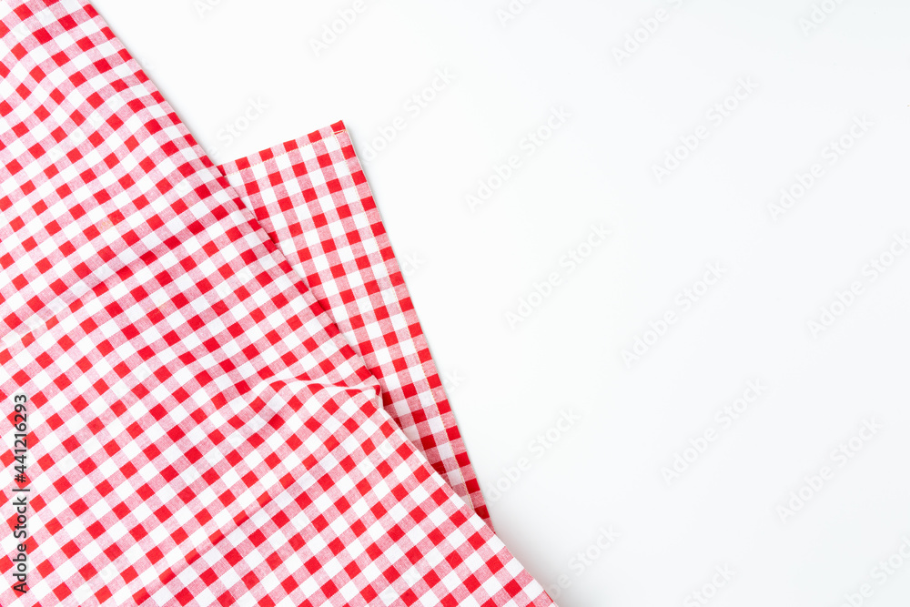 Top view tablecloth texture. Abstract fabric checkered red and white, isolated on a white background with copy space. Top view tablecloth texture. Abstract fabric checkered red and white, isolated on a white background with copy space.