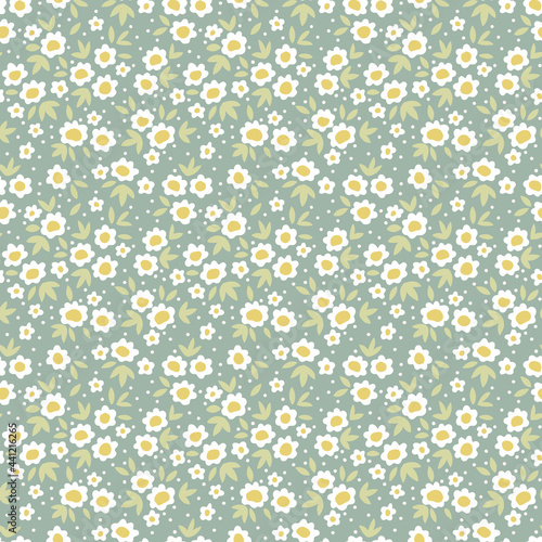 Floral pattern. Pretty flowers on blue gray background. Printing with small white daisy flowers. Ditsies print. Seamless vector texture. Spring bouquet.