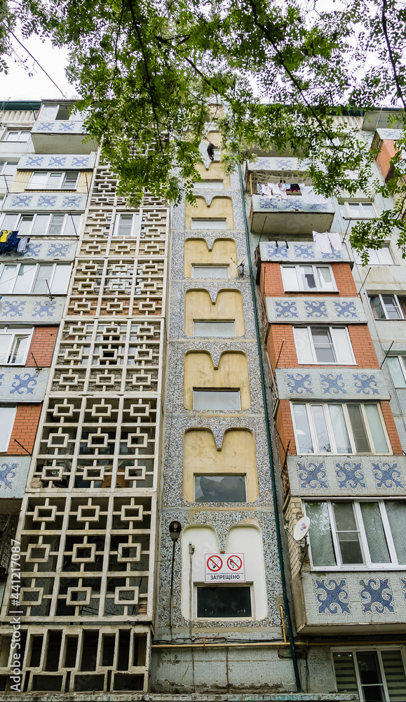 Colorful facade of a Soviet-built house. Derbent, Dagestan, Russia