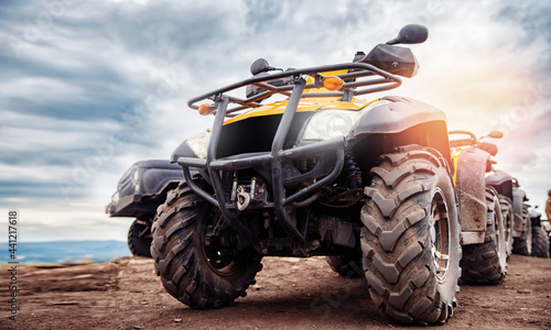 ATV quad bike on forest offroad, front view. Concept motocross quadricycle summer travel background photo