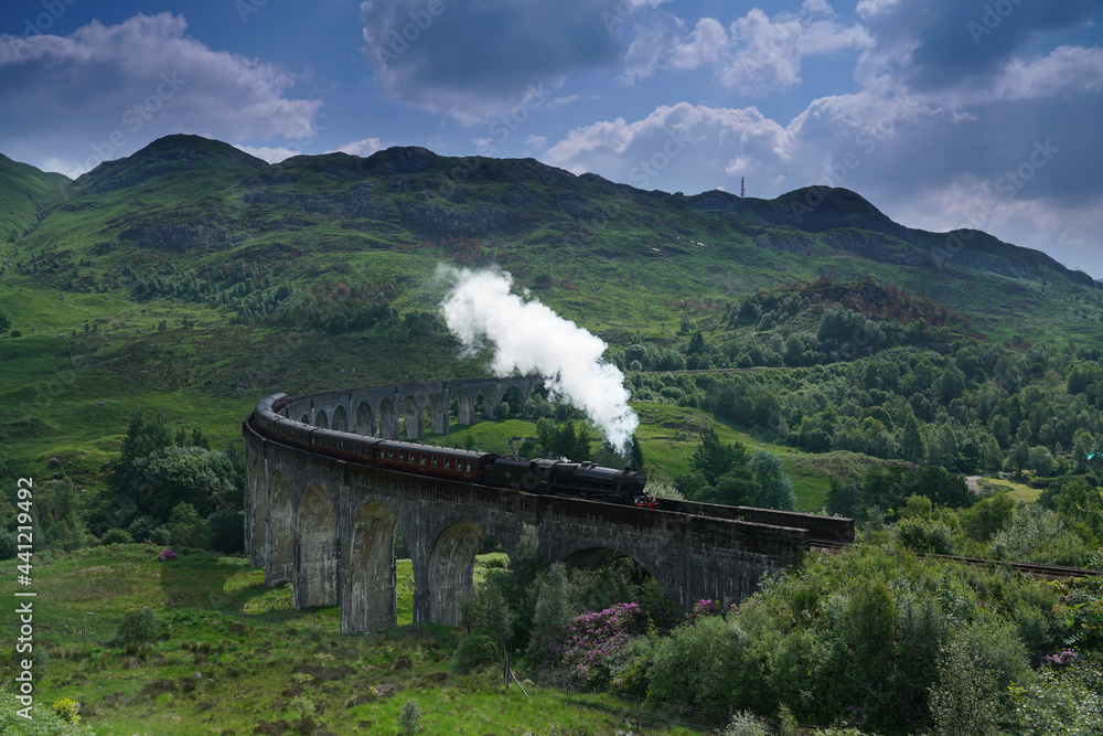 Naklejka premium The Jacobite train crossing Glenfinnan Viaduct, Highlands, Scotland.