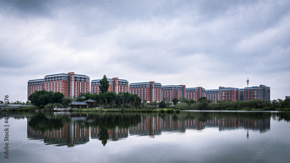 Teaching building of Guangzhou Xinhua College Dongguan Campus. Cityscape of Dongguan, China. Teaching building of Guangzhou Xinhua College Dongguan Campus. Cityscape of Dongguan, China.