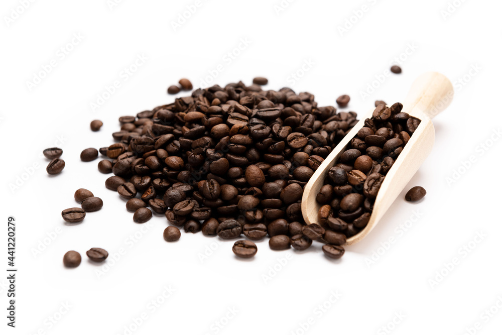 Coffee on wooden spoon isolated on white background Coffee on wooden spoon isolated on white background