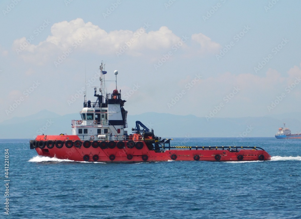 A red tug boat near the port of Piraeus, Greece