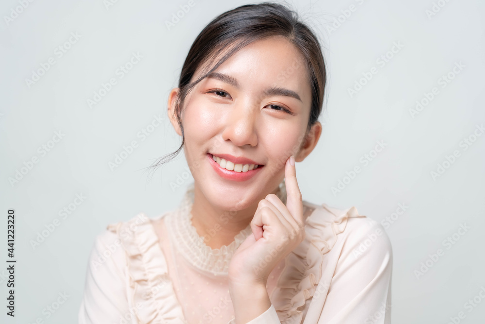 Beautiful young asian woman with clean fresh skin on white background. Asian women portrait. Beautiful young asian woman with clean fresh skin on white background. Asian women portrait.