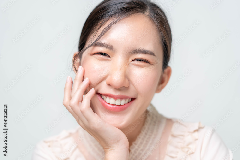 Beautiful young asian woman with clean fresh skin on white background. Asian women portrait. Beautiful young asian woman with clean fresh skin on white background. Asian women portrait.