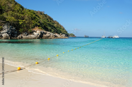 blue sea  island  sand beach and yachts. tropical landscape with paradise exotic island. Summer travel  adventure and sea trip vacation concept.