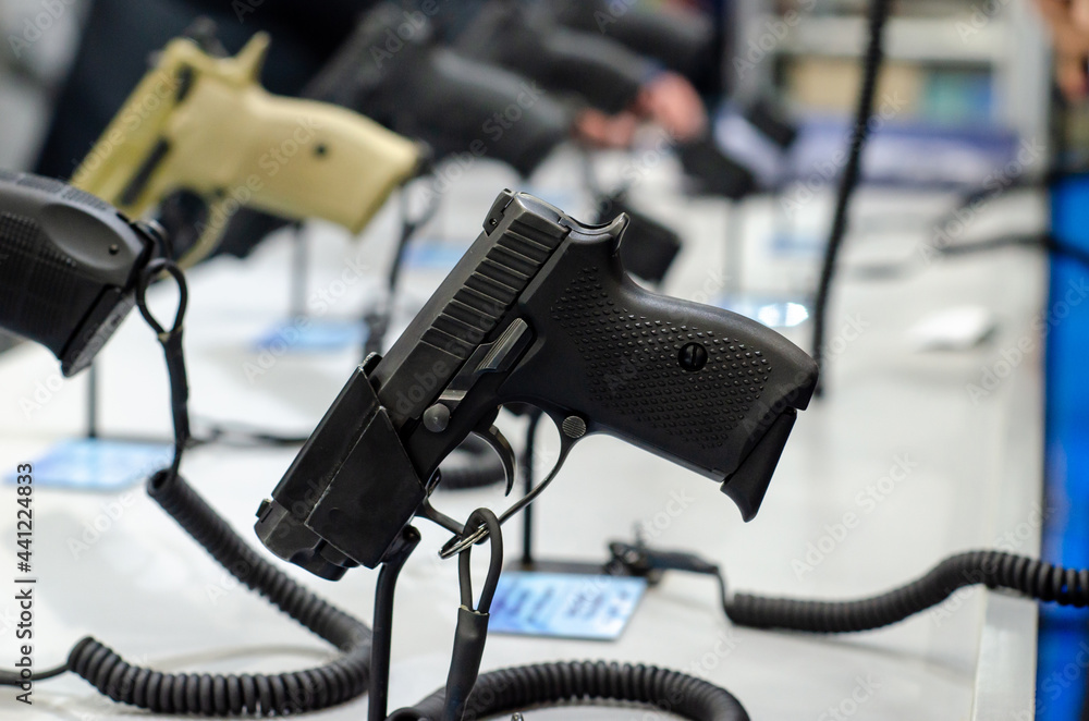 Handgun store shelves. A handgun for sale in the store. Handgun store shelves. A handgun for sale in the store.