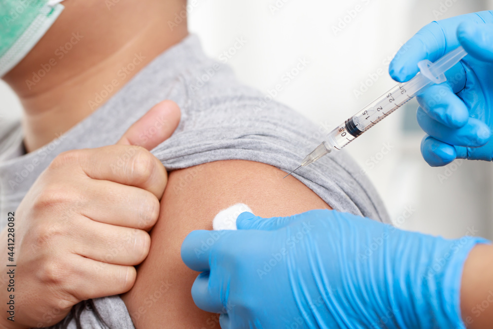 Man get vaccinated for social immunization. Man get vaccinated for social immunization.