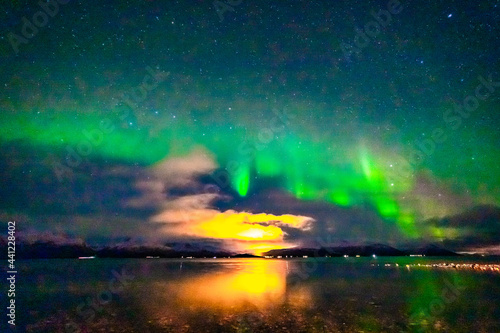 Nordlichter   ber dem Fjord in Troms bei Troms  . Aurora Borealis in the sky  heavenly light in the dark night. the lady dance in the sky. Polarlicht  Nordlicht in Norwegen